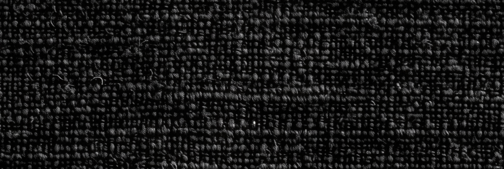 Black burlap fabric texture.